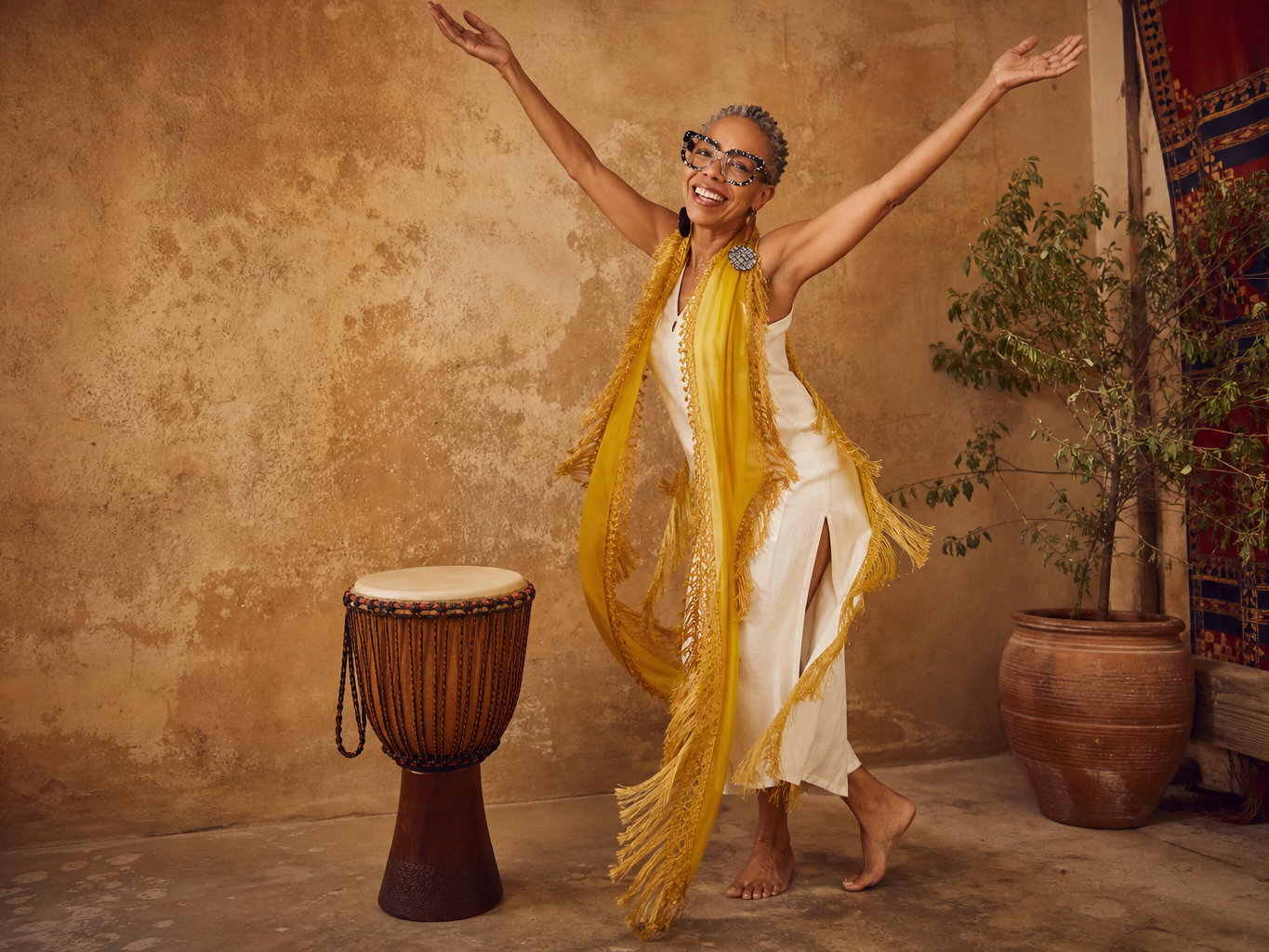 Bernadette dancing beside a djembe
