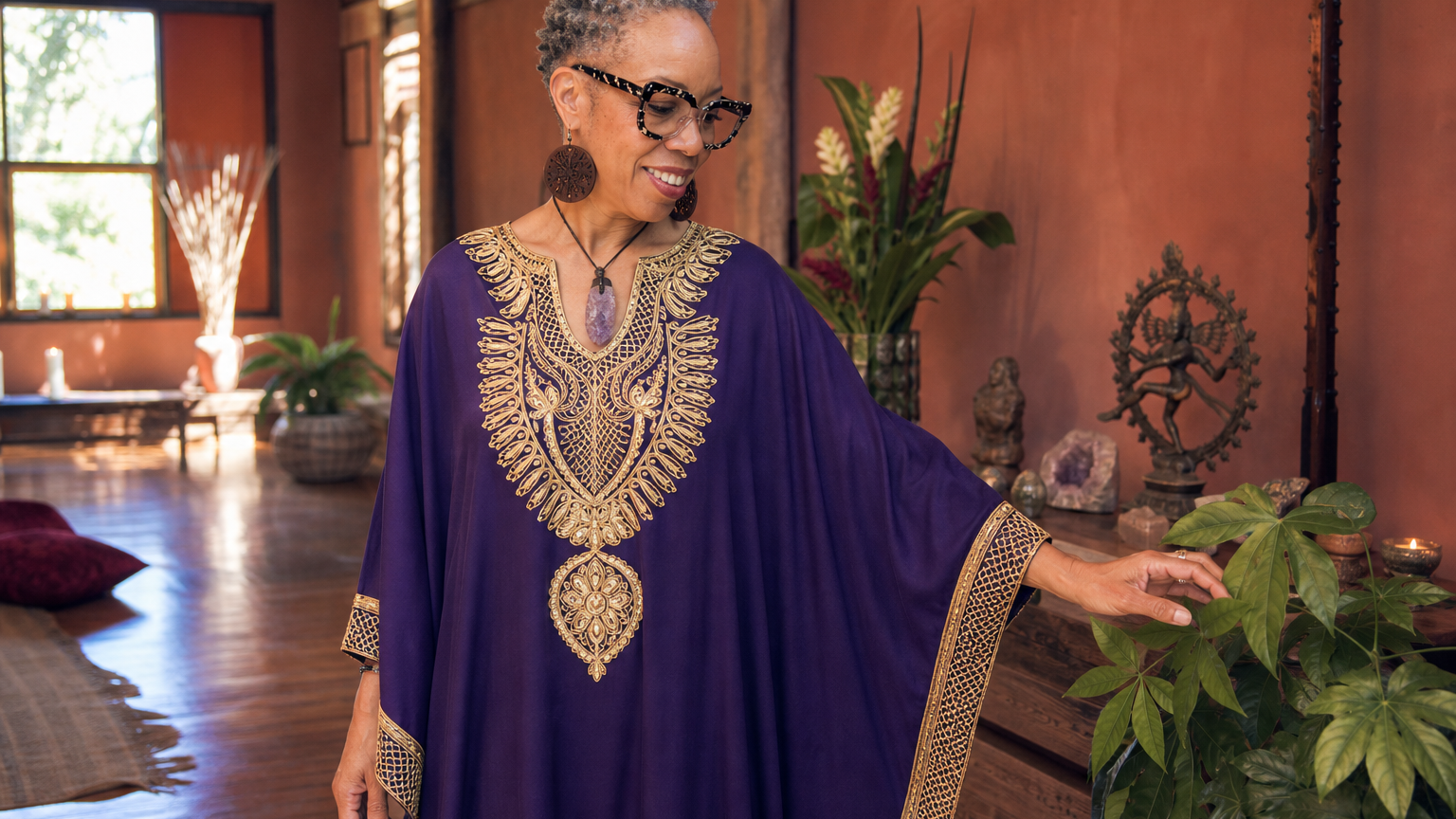 Bernadette in a flowing purple and gold caftan